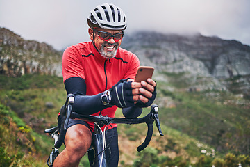 Image showing Happy man, cyclist and phone on mountain bicycle in communication, social media or networking in nature. Male person or athlete smile on mobile smartphone app in sports workout, fitness or cycling