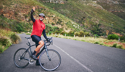 Image showing Selfie, mountain and man cycling for exercise, training and workout goals in nature for social media. Sports, travel blog and male cyclist take picture for wellness, cardio and fitness on adventure