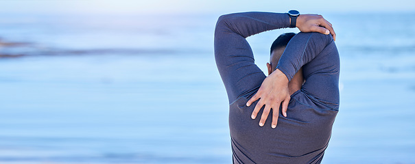 Image showing Back, beach and man with fitness, stretching and exercise with warm up, training and cardio sport routine. Person, outdoor or athlete stretch arms, workout and prepare to start activity with wellness