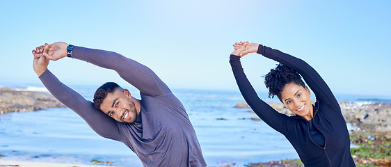 Image showing Beach workout, stretching and portrait of happy people, couple of friends and smile for exercise performance. Blue sky, ocean sea and nature team training, arm muscle flexibility and start warm up