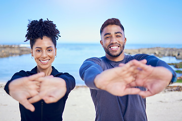 Image showing Portrait, beach and couple stretching, fitness and exercise with training, warm up and runner with wellness. Healthy people, man and woman stretch, seaside and workout with sports, ocean and energy