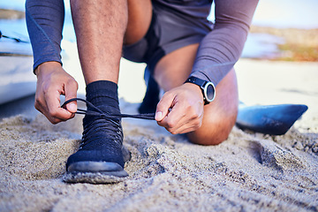 Image showing Hands tie shoes, ocean and athlete start workout, training and kayak exercise outdoor. Sand, person and tying sneakers at beach to prepare for fitness, sports and healthy body for wellness in summer.