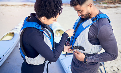 Image showing Life jackets, safety and couple prepare for water, boat and journey on river with protection or people on lake adventure together. Lifejacket, man and woman or instructor helping with sport vest