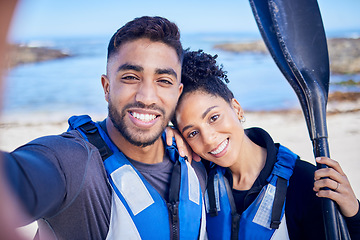 Image showing Selfie, kayak and couple with a love, beach and summer vacation with memory, paddle and picture. Portrait, people and man with woman, water sports and social media with ocean, honeymoon and holiday