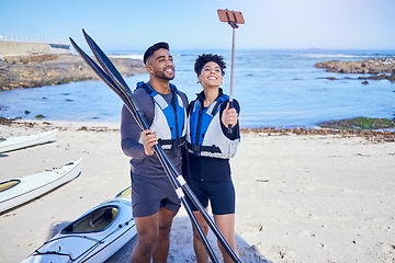 Image showing Couple, selfie and outdoor for kayak or travel at a beach with stick for vacation memory. A man and woman with a profile picture for social media, influencer post and canoe or water sports in nature