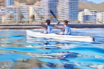 Image showing Water, man and woman in kayak in speed for sports race on lake, beach or river for exercise together on vacation. Ocean holiday, adventure and fitness, couple in canoe for training workout challenge.