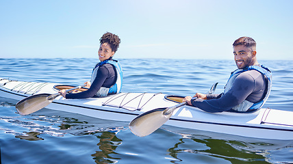 Image showing Ocean, portrait of happy man and woman in kayak at lake, beach or river for exercise challenge. Sports holiday, adventure and fitness, couple rowing in canoe for training workout and fun race at sea.