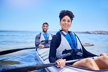 Image showing Water, man and woman in kayak for race at lake, beach or river for exercise in sports at sea. Ocean holiday, adventure and fitness, happy couple with smile rowing in canoe for training or challenge.