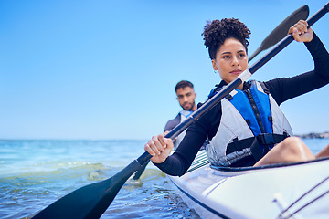 Image showing Water, man and woman in kayak at ocean for race at lake, beach or river, exercise in sport. Holiday, adventure and fitness, couple rowing in canoe for training or challenge, mockup on blue sky at sea