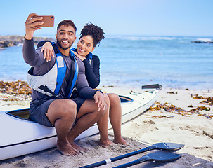 Image showing Selfie, kayak and a couple on the beach to travel together for freedom, summer vacation or holiday. Relax, love or happy with a sports man and woman on a boat by the ocean or sea for adventure