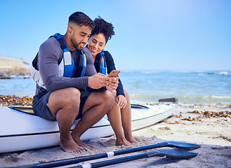 Image showing Couple, phone and outdoor for kayak or travel at a beach with internet connection or chat. A man and woman with a smartphone for social media, streaming water sports video and canoe space in nature