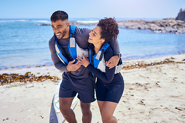 Image showing Love, happy and kayak with a couple walking on the beach for travel, freedom or sports outdoor in nature. Smile, summer vacation or holiday with a man and woman by the sea or ocean for canoeing