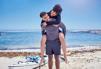 Image showing Beach, fitness and kayak couple piggyback at the ocean for training, bond and workout in nature together. Kayaking, love and man carrying woman at sea for rowing adventure, workout or celebration