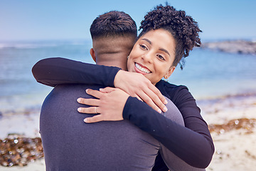 Image showing Fitness, face and couple hug at a beach for sports, training and morning cardio in nature. Love, smile and happy woman embrace man at the ocean for running, workout or wellness exercise with support