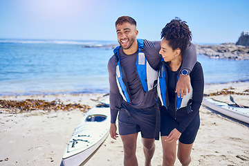 Image showing Love, happy and kayak with a couple laughing on the beach for travel, freedom or sports outdoor in nature. Funny, summer vacation or holiday with a man and woman by the sea or ocean for canoeing