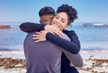 Image showing Fitness, portrait and couple hug at a beach for sports, training and morning cardio in nature. Face, smile and happy woman embrace man at the ocean for running, workout or wellness exercise with love