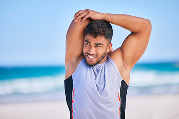 Image showing Happy man, stretching and fitness on beach for workout, exercise or outdoor training in sports. Muscular, athlete or sporty male person smile in body warm up or preparation on ocean coast in nature