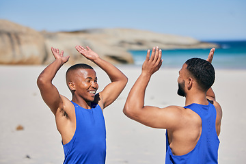 Image showing Happy man, friends and high five in fitness on beach for workout success, training or outdoor exercise. Excited male person smile in happiness, teamwork or sports motivation together on ocean coast