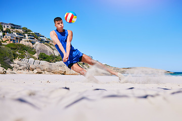 Image showing Beach volleyball, sports and man diving for ball, outdoor game or nature training for athletic challenge, action or match. Mockup blue sky, sand and player workout, activity and exercise in Australia