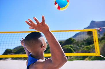 Image showing Summer beach, sports and person serve volley ball, play competition and player training, workout or exercise. Blue sky, tropical island and back of athlete start game, action or practice challenge