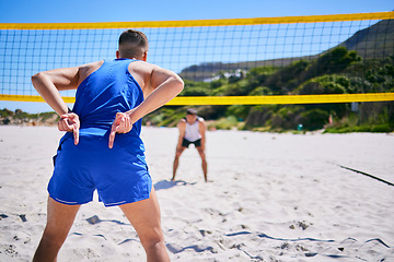 Image showing Volleyball, exercise and man at beach with hand sign to block angle of attack. Sports, back and gesture of athlete outdoor in workout, training or competition for healthy body, wellness and summer