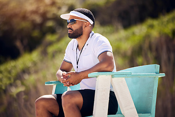 Image showing Summer, sports and a volleyball referee in a chair on the beach for authority, rules or regulations during a game. Health, professional or competition with a serious man refereeing a match in the day