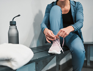 Image showing Fitness, tie shoes and sport woman in gym locker room for exercise, workout, healthy lifestyle and wellness. Person and shoelaces in sportswear for training, cardio and strong muscle for competition