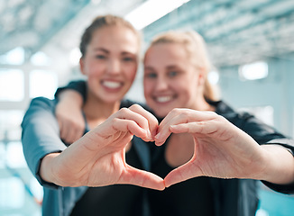 Image showing Happy woman, swimming and heart hands in care, support or teamwork in sport fitness together at pool. Female person or professional swimmer with loving emoji, shape or symbol in team exercise or goal