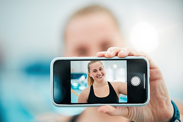 Image showing Phone, selfie or happy woman after a swimming exercise, training or workout with photograph. Relax, screen or hand of excited female swimmer taking a picture to post on mobile app on fitness break