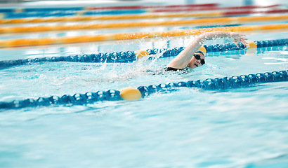 Image showing Swimming exercise, pool and sports person training for challenge, freestyle competition or performance workout. Gym club swimmer, water splash and active athlete cardio, race or practice stroke