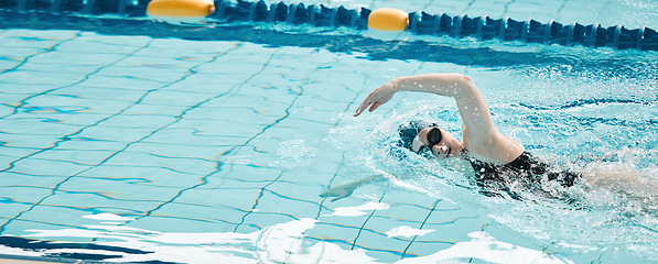 Image showing Sports, swimming and woman athlete training for a race, competition or tournament in a pool. Fitness, workout and female swimmer practicing a cardio water skill for exercise, speed or endurance.