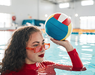 Image showing Swimming, water polo and woman with ball, exercise and workout in summer. Sport, sunglasses and person in pool, training and fitness for healthy body, wellness and practice match in competition game