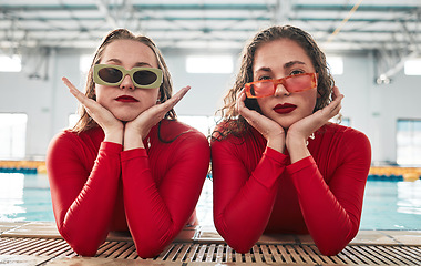 Image showing Women, sunglasses portrait and fashion at a pool with gen z, hipster and style of girl friends with clothes. Red swimsuit, cool and trendy urban glasses with young people together in water and gym