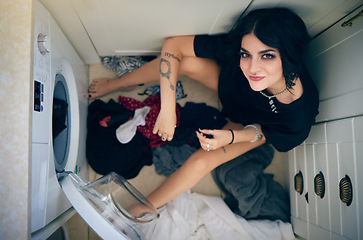 Image showing Top view, laundry cleaning and woman by washing machine in home getting ready to wash clothing. Spring cleaning, hygiene and portrait of happy female sitting on floor preparing for housework alone.