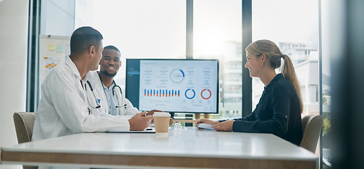 Image showing Teamwork, consulting and doctors with patient in hospital in meeting for help or assistance. Healthcare documents, data charts and woman in consultation with medical workers for vaccine information.