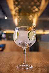 Image showing Gin tonic cocktail with sliced cucumber