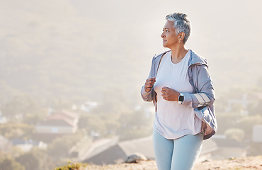 Image showing Running, mature woman and fitness on mountains, nature background and exercise for healthy goals, energy or marathon. Senior lady, cardio and outdoor training workout with motivation, focus or mockup