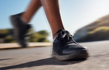 Image showing Fitness shoes, run and training workout of a woman running on a road fast in nature. Marathon, sport and asphalt street runner doing exercise, sports or speed on concrete outdoor doing cardio