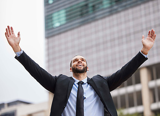 Image showing Businessman celebration, city and winning with smile, success or suit in financial advisor job. Corporate man, hands and air goals, vision or motivation by metro buildings with happiness in New York