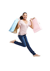 Image showing Fashion, portrait and woman jump with shopping bags in studio isolated on white background mockup. Discount celebration, sales deals and happy female customer jumping with gifts after buying at mall