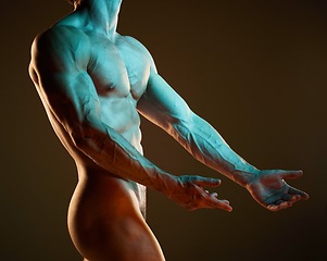 Image showing Body, art and muscle with a nude man in studio on a dark background for artistic expression or freedom. Creative, sexy and model with a naked male posing to promote artwork, sensuality or fitness