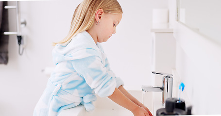 Image showing Cleaning, child and girl washing hands in the bathroom with soap for hygiene, healthcare and independence at home. Young, water and healthy kid doing sanitary routine at a sink for toxic bacteria