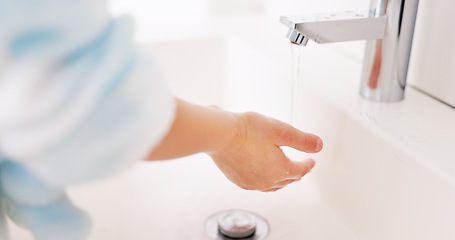 Image showing Cleaning, child and girl washing hands in the bathroom with soap for hygiene, healthcare and independence at home. Young, water and healthy kid doing sanitary routine at a sink for toxic bacteria