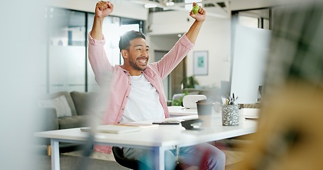 Image showing Winner, wow and cheering with a business man reaching a goal or target in his office at work. Motivation, goals and success with a male employee in celebration of a deal or promotion while working