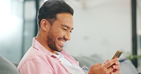 Image showing Phone, sofa and happy man in living room on social media, texting or web scrolling. Relax, cellphone and male on couch in home with mobile smartphone for networking, internet browsing or messaging.