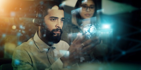 Image showing Man, woman and overlay by computer in night for tech support crm, strategy or teamwork in futuristic office. Young businessman, 3d holographic ux or planning together for vision, goals and innovation