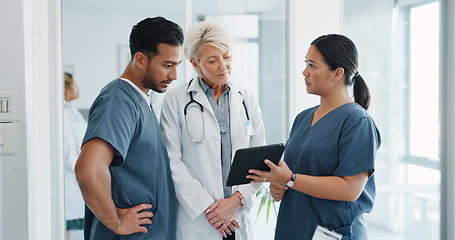 Image showing Doctor, team and tablet in discussion with senior for healthcare training, advise or support at hospital. Medical professionals with touchscreen in conversation, collaboration or teamwork at clinic