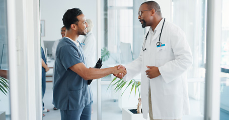 Image showing Doctor, handshake or nurse on tablet in hospital teamwork collaboration, medical research planning or surgery vision idea. Smile, happy or shaking hands healthcare workers, technology or welcome talk