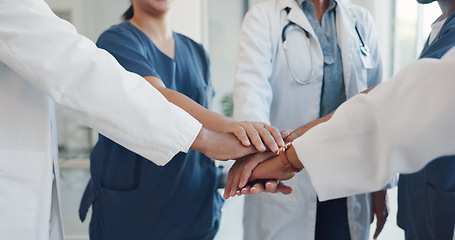 Image showing Healthcare team, hands together and celebration in hospital for teamwork success, medical collaboration and happiness motivation. Medic support, doctors smile and nurse celebrate or excited in clinic