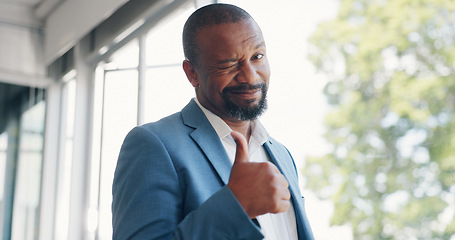 Image showing Walking, wink and thumbs up with a business black man looking happy with a mindset of future growth. CEO, management and trust with a senior male employee making a hand sign or gesture at work